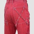Mens red gothic cargo pants featuring utility pockets, zipper accents, adjustable straps, and alternative darkwear styling