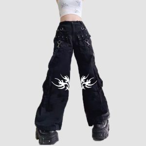 Mens tribal gothic cargo pants in black featuring white tribal graphic artwork, utility cargo pockets, wide-leg fit, and metal ring details