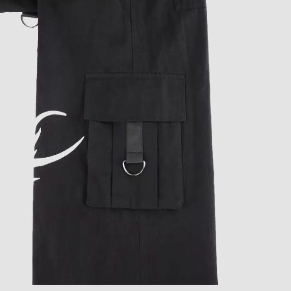 Mens tribal gothic cargo pants in black featuring white tribal graphic artwork, utility cargo pockets, wide-leg fit, and metal ring details