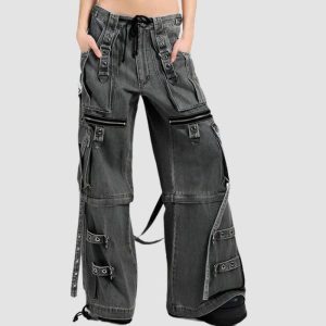 Wide leg cargo jeans in black wash denim with utility pockets, adjustable straps, and relaxed streetwear styling
