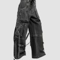 Wide leg cargo jeans in black wash denim with utility pockets, adjustable straps, and relaxed streetwear styling