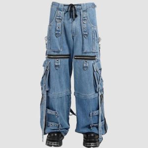 X-Strap utility denim pants in light blue denim with cargo pockets, D-ring hardware, and wide-leg streetwear styling
